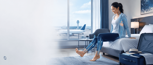 Woman performing simple circulation exercises after a long-haul flight to promote healthy blood flow and reduce the risk of deep vein thrombosis (DVT).